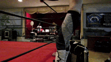 a wrestling ring with a sign that says ' tower 's brewing co. ' on it