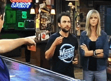 a man wearing a t-shirt that says ' magn ' on it