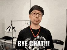 a man wearing glasses says bye chat !!!