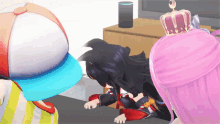 a girl with a crown on her head is laying on the floor next to another girl .