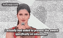 a woman is talking into a microphone and saying `` i actually had asked to present this award specifically on education '' .