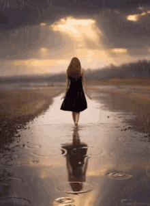 sad girl walking alone in the rain