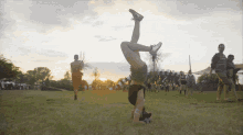 Headstand Lightning In A Bottle GIF - Headstand Lightning In A Bottle Upside Down GIFs