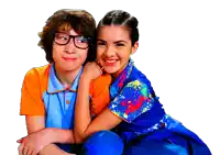 a boy and a girl are posing for a picture