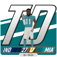 a miami dolphins football player giving the thumbs up