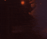 a large monster is surrounded by flames and a light coming out of it 's head .