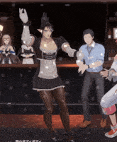 a man in a blue shirt with a name tag on his neck stands next to a woman in a maid outfit