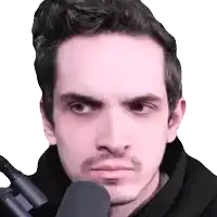 a close up of a man 's face with a microphone in front of it