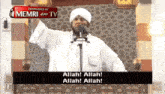 a man stands in front of a microphone and says " allah allah allah allah "