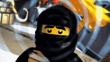 a close up of a lego ninjago character with a black hood