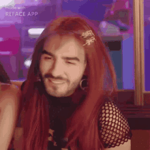 a man with a beard is wearing a red wig and earrings