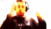 a blurry image of a person wearing headphones and a shirt that says ' nirvana '