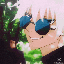 a close up of a person wearing sunglasses with a smile on their face