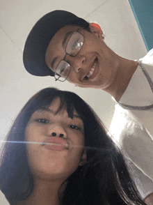a man and a woman are posing for a picture