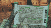 a person holding a map that says the foreign lands on it