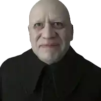 a bald man wearing a black coat has a button on the collar