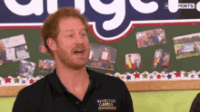 a man wearing a black shirt that says invictus games on it