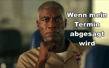 a man sitting on a plane with the words wenn mein termin abgesagt wird written on the bottom