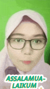 a woman wearing glasses and a hijab with the words assalamua-laikam above her