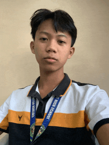a young man with a lanyard around his neck that says " high school "