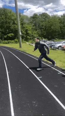 a man is running on a track in the woods