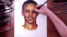 a person is drawing a man 's face with colored pencils and a marker that says uniball
