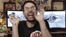 a man wearing glasses and a shirt that says let 's wild on it