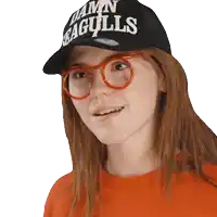 a girl wearing glasses and a hat that says damn seagulls
