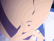 a close up of a person 's face with their finger on their mouth