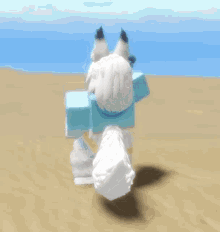 a white fox with a long white tail is standing in the sand .