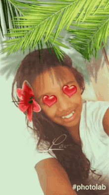 a girl with a flower in her hair has hearts in her eyes and the hashtag #photolab
