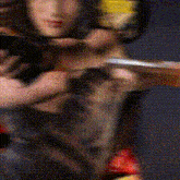 a blurry image of a woman holding a dog