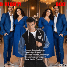 a man in a hoodie is standing in front of two women in blue dresses
