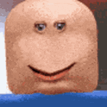 a close up of a person 's face with a smile on it .