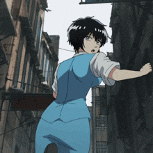 a woman in a blue suit is standing in a narrow alleyway