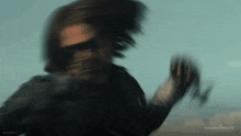 a blurry picture of a man with the words thunderbolts on the bottom