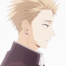 a close up of a man 's ear with earrings