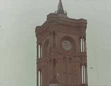 a clock tower with a clock on it that shows the time as 1:50