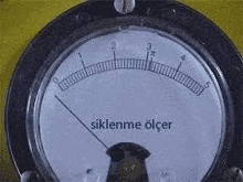 a close up of a gauge with a needle pointing to the number 5 on it .