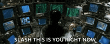 a man is sitting in front of a bunch of computer monitors with the words " slash this is you right now " on the bottom