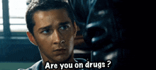 a man is being questioned by a police officer and says " are you on drugs "