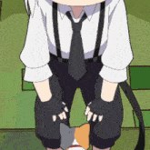 a man in a white shirt and black tie holds a cat in his arms