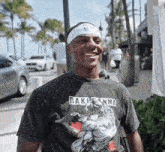 a man wearing a headband and a shirt that says bakumanma