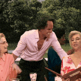 a group of people sitting around a table with a menu that says dinner