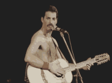 Queen Freddie Mercury GIF - Queen Freddie Mercury Guitar GIFs