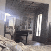 a room with a piano in it and a mirror