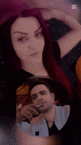 a man is smoking a cigarette in front of a woman in a red heart