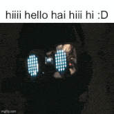 a person wearing glowing goggles that say hiii hello hai hiii hi : d