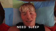 a man laying on a bed with his eyes closed and the words need sleep written above him