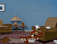 a cartoon character is laying in a chair with his head in his hands and the words `` ya voy '' written on the floor .